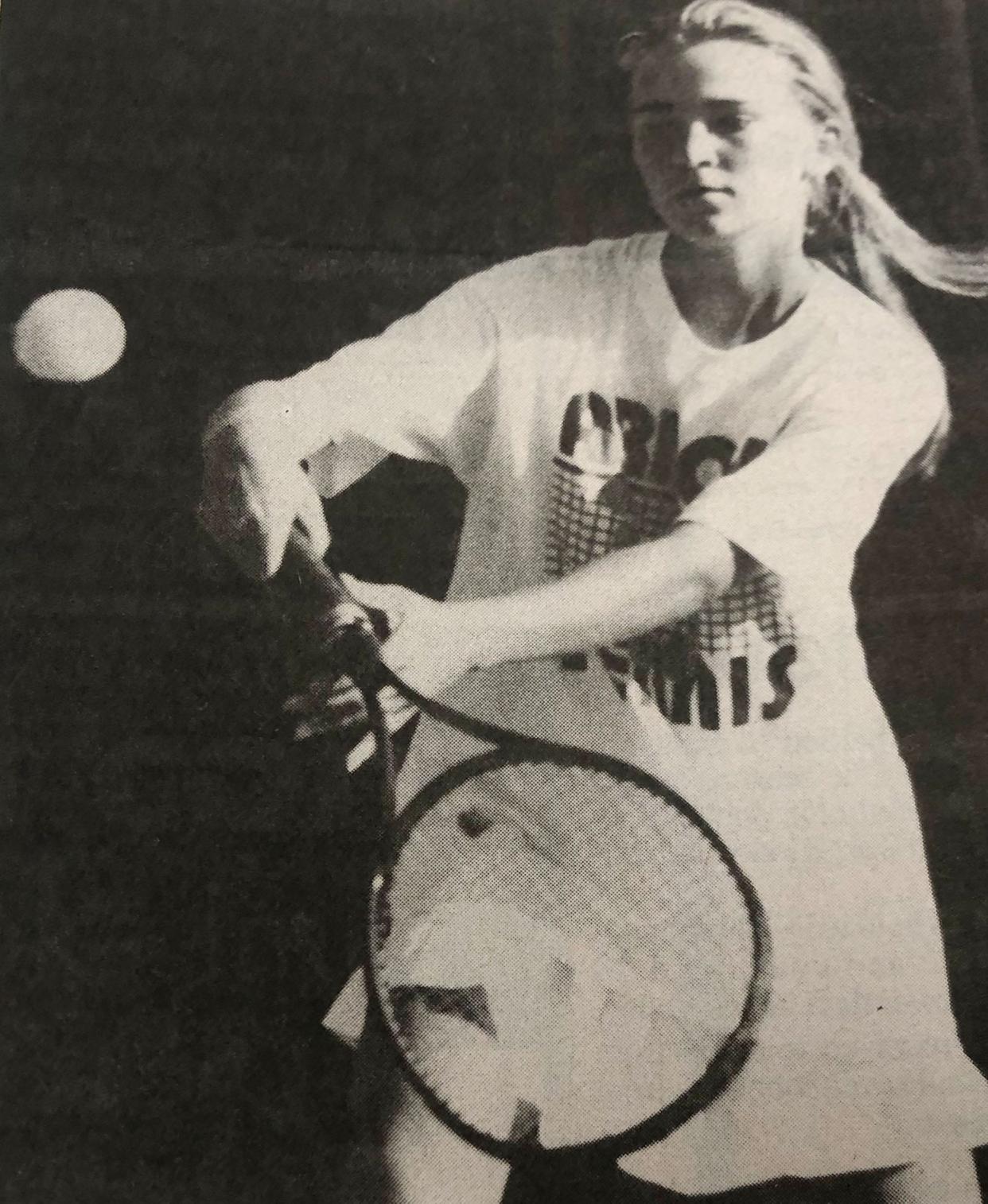 Watertown's Missy Meester hits a backhand shot during a high school girls tennis match in the mid-1990s.