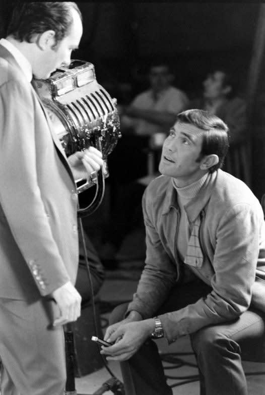 George Lazenby fiddles with a knife while chatting with director Peter R. Hunt. "He was a great looking guy and he moved very well," the director, who died in 2002, once said. "I think if things had gone the other way, he would have gone on to be a very good Bond." (Loomis Dean—Time & Life Pictures/Getty Images) <br> <br> <a href="http://life.time.com/culture/behind-the-scenes-at-james-bond-auditions/#1" rel="nofollow noopener" target="_blank" data-ylk="slk:Click here;elm:context_link;itc:0;sec:content-canvas" class="link ">Click here</a> to see the full collection at LIFE.com