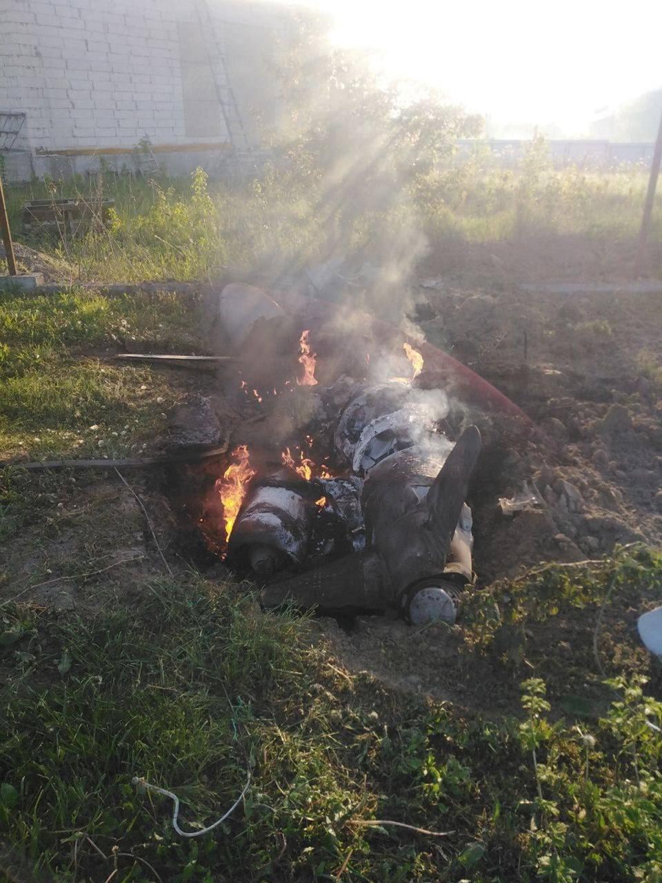 A Russian cruise missile shot down by Ukrainian Air Defence Forces is seen in the backyard of a house in the Kyiv region on Thursday (via REUTERS)