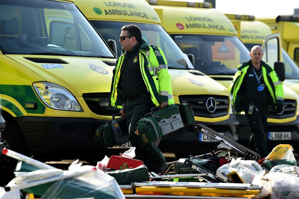 Staff prepare to load equipment into London Ambulance Service vehicles in the east car park at the ExCeL London exhibition centre in London on March 28, 2020, that is being transformed into a field hospital to be known as the NHS Nightingale Hospital to help with the novel coronavirus COVID-19 outbreak. - Britain on March 24 said it will open a 4,000-bed field hospital at a London exhibition centre to treat coronavirus cases in the latest measure to tackle the outbreak after the government ordered a nationwide lockdown. (Photo by Glyn KIRK / AFP) (Photo by GLYN KIRK/AFP via Getty Images)