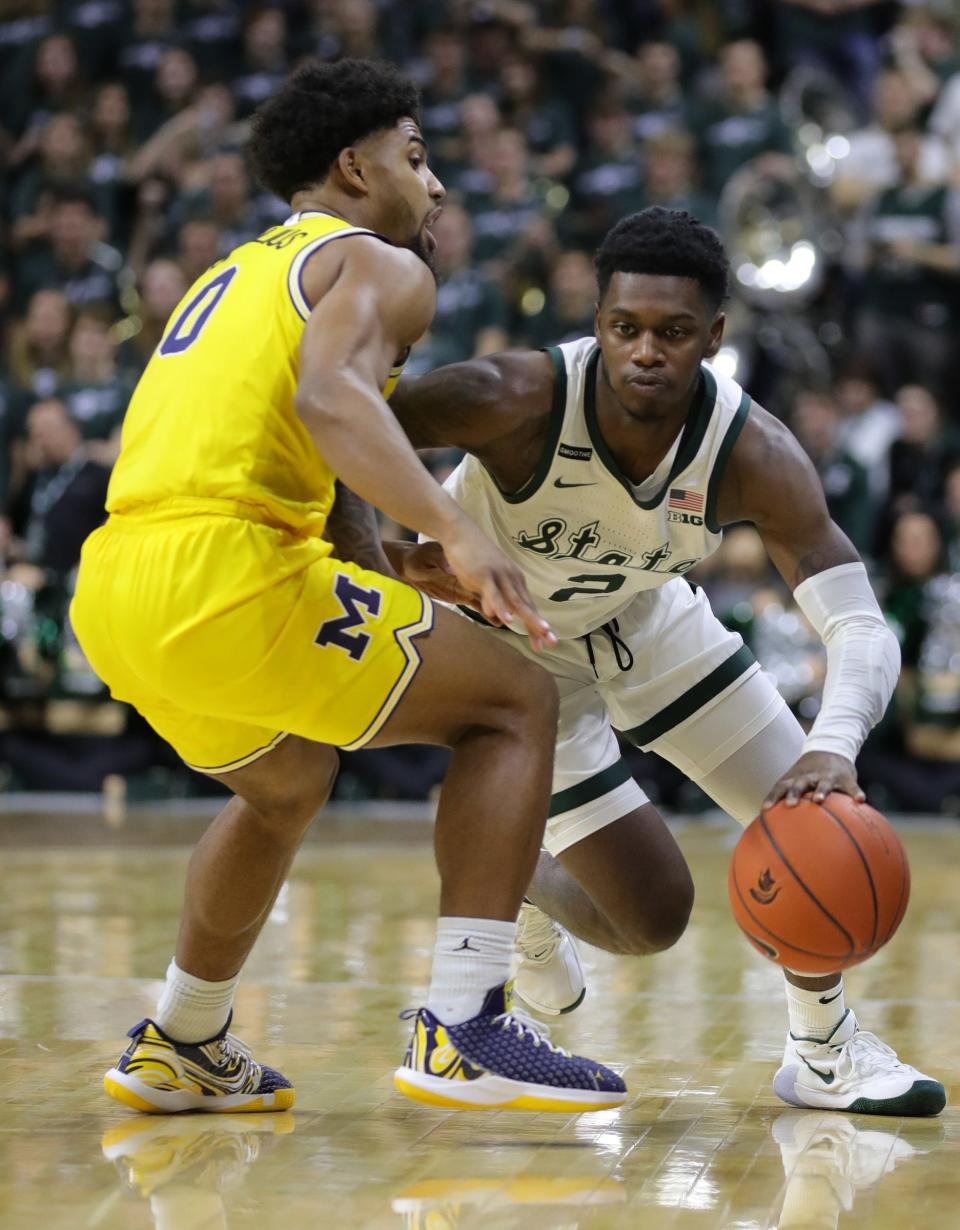 Michigan State guard Rocket Watts drives against Michigan guard David DeJulius during the second half  of MSU's 87-69 win over U-M on Sunday, Jan. 5, 2020, in East Lansing.