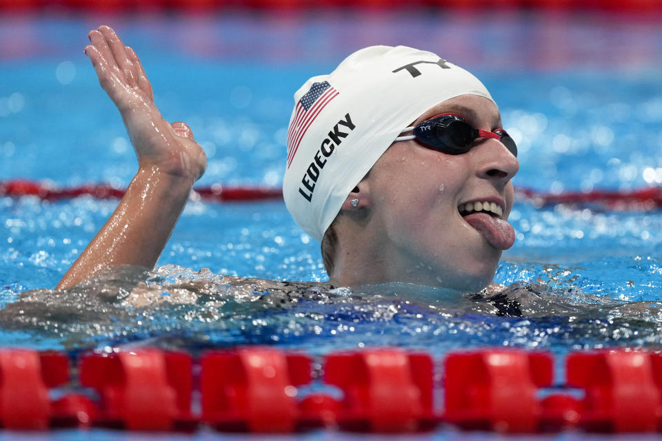 Katie Ledecky, of the United States, reacts after winning a heat of the women's 800-meter freestyle at the 2020 Summer Olympics, Thursday, July 29, 2021, in Tokyo, Japan. (AP Photo/Charlie Riedel)