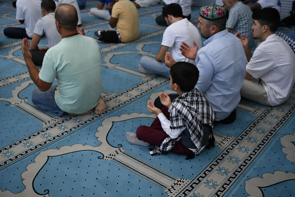 Muslims pray in a mosque in Athens, Greece, Friday, Oct. 13, 2023. In Muslim communities across the world, worshippers gathered at mosques for their first Friday prayers since Hamas militants attacked Israel, igniting the latest Israel-Palestinian war. (AP Photo/Michael Varaklas)