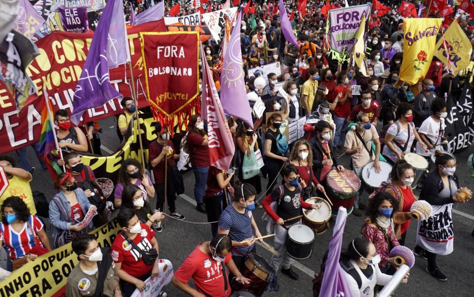 People take part in a demonstration against the Brazilian President Jair Bolsonaro's handling of the COVID-19 pandemic in Sao Paulo, on July 3, 2021 - Anadolu