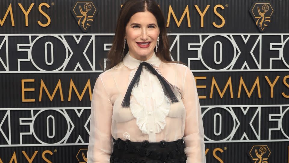 Kathryn Hahn wore Sophie Bille Brahe jewelry and a Spring-Summer 2019 Dior Haute Couture cocktail ensemble, comprised of an ivory organza bib-front shirt and black embroidered skirt. - Aude Guerrucci/Reuters