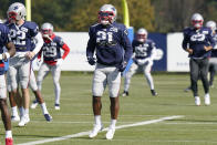 New England Patriots defensive back Adrian Phillips (21) warms up during an NFL football practice, Wednesday, Oct. 20, 2021, in Foxborough, Mass. (AP Photo/Steven Senne)