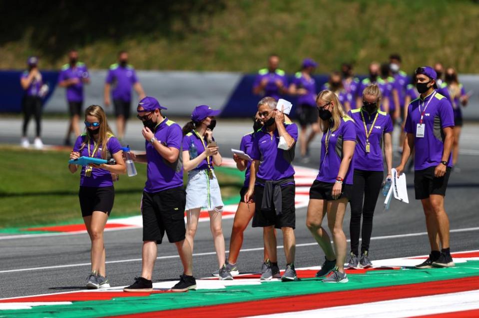 The teams and drivers walk the track in Austria before the race on Saturday.