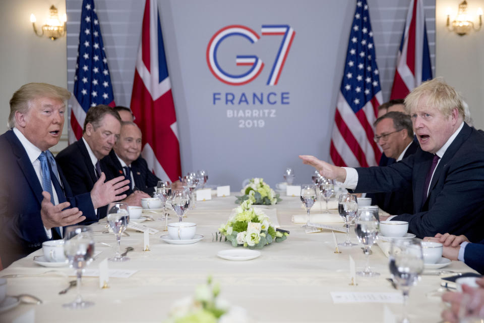President Donald Trump and Britain's Prime Minister Boris Johnson, right, attend a working breakfast at the Hotel du Palais on the sidelines of the G-7 summit in Biarritz, France, Sunday, Aug. 25, 2019. (AP Photo/Andrew Harnik)
