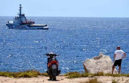 Spanish migrant rescue ship Open Arms is seen close to the Italian shore in Lampedusa