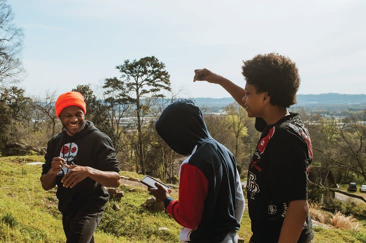 <span class="article__caption">Kendall Martin, WeClimb founder, with WeClimb members Stephen and Micah.</span> (Photo: Linden Taber )