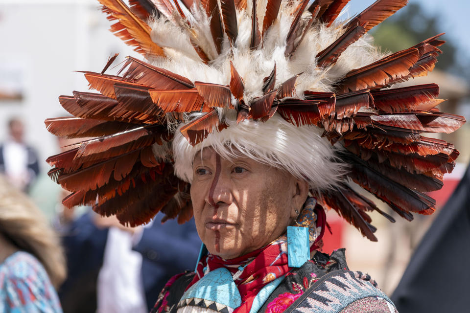 A supporter waits for President Joe Biden to speak and sign a proclamation designating the Baaj Nwaavjo I'Tah Kukveni National Monument at the Red Butte Airfield Tuesday, Aug. 8, 2023, in Tusayan, Ariz. (AP Photo/Alex Brandon)