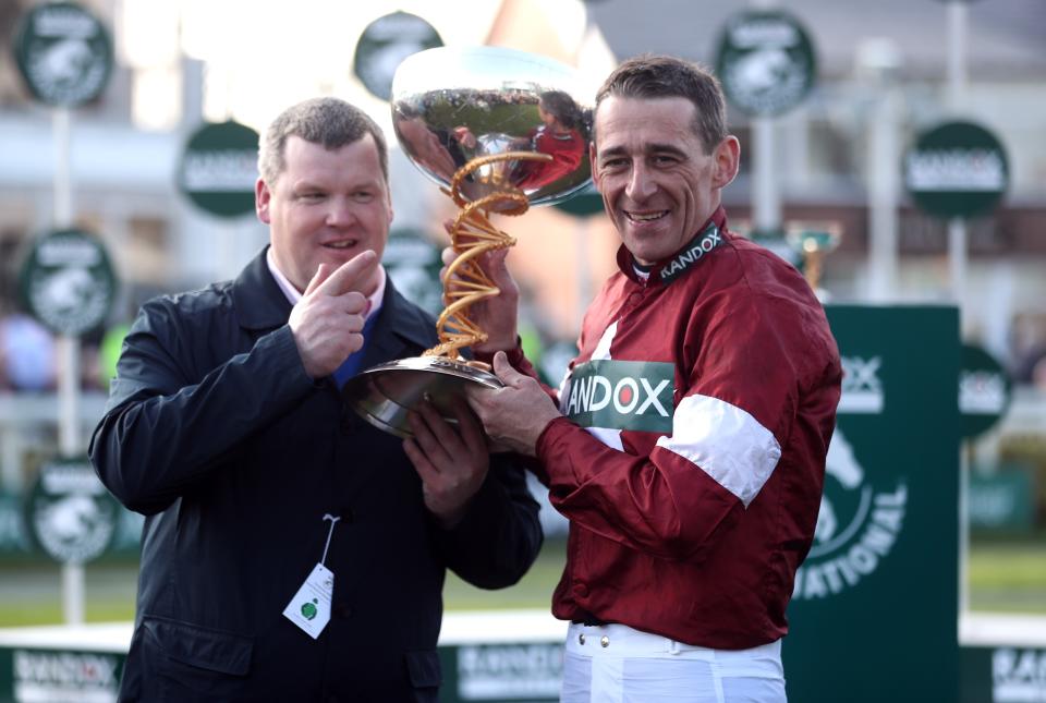 Winning Jockey Davy Russell and trainer Gordon Elliott (left) are all smiles after winning with Tiger Roll