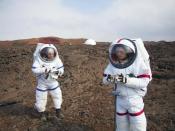 In this May 23, 2014 photo provided by the University of Hawaii, Lucie Poulet, right, uses a geotechnical tool while Annie Caraccio records the data during a previous study outside the domed structure that will house six researchers for eight months in an environment meant to simulate an expedition to Mars, on Mauna Loa on the Big Island of Hawaii. The group will enter the dome Thursday, Jan. 19, 2017, and spend eight months together in the 1,200-square-foot research facility in a study called Hawaii Space Exploration Analog and Simulation (HI-SEAS). They will have no physical contact with any humans outside their group, experience a 20-minute delay in communications and are required to wear space suits whenever they leave the compound. (Ross Lockwood/University of Hawaii via AP)