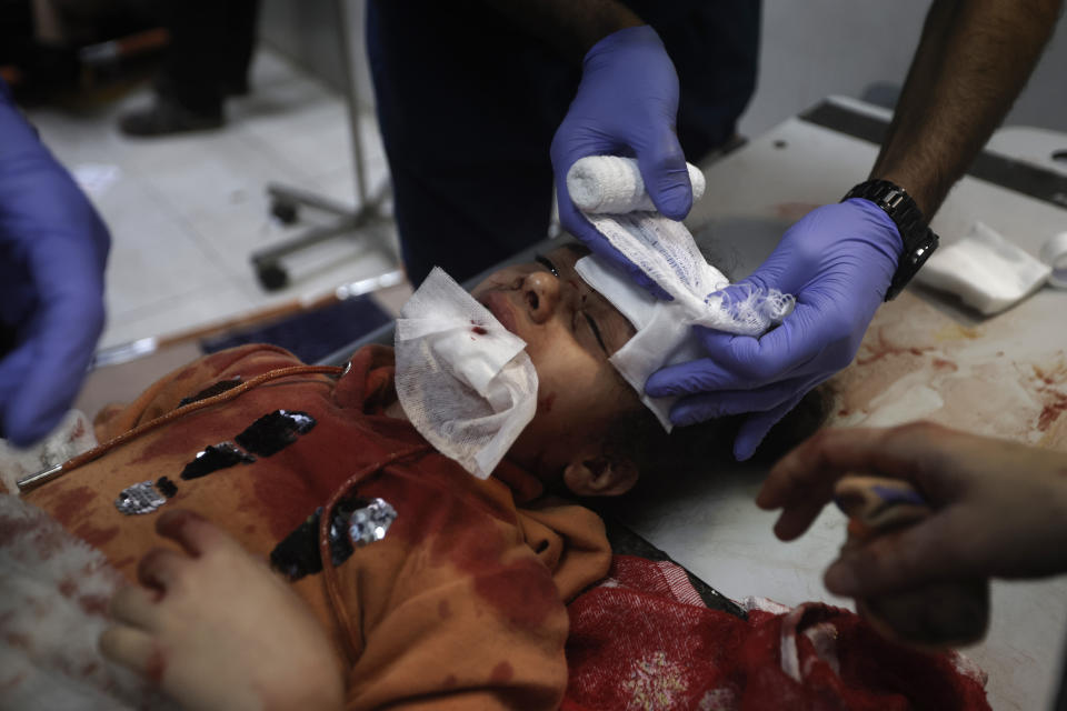 A Palestinian girl wounded in the Israeli bombardment of the Gaza Strip receives treatment at a hospital in Khan Younis on Monday, Dec. 18, 2023. (AP Photo/Mohammed Dahman)