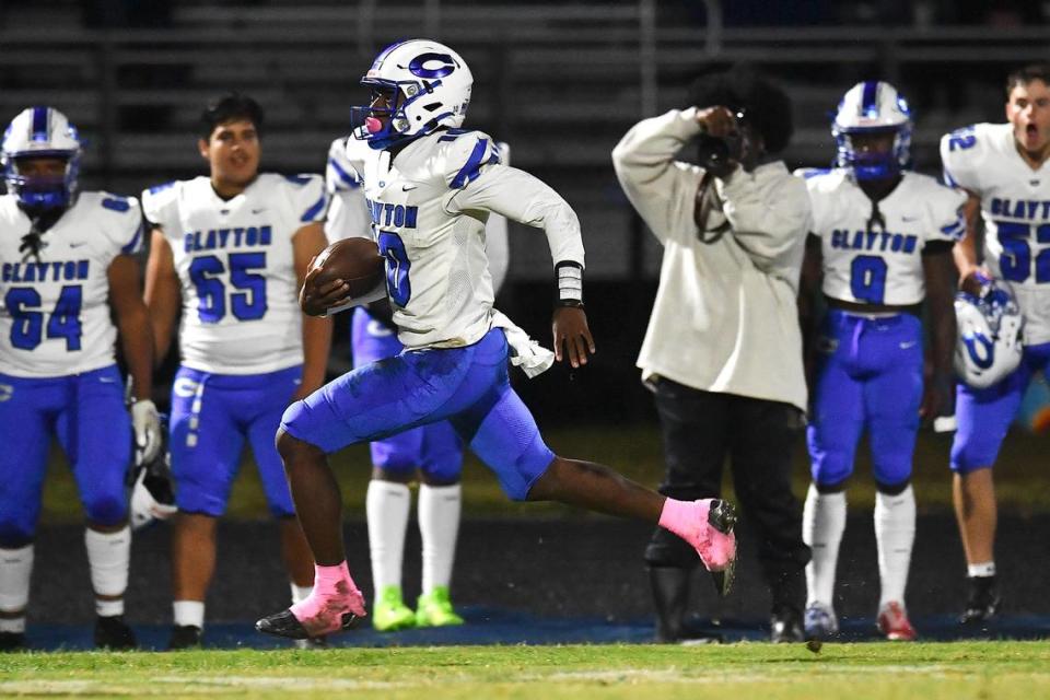 Clayton quarterback Johnathan Montague (10) runs for long yardage against Willow Spring during the first half. The Clayton Comets and the Willow Spring Storm met in a conference football game in Fuquay-Varina, N.C. on October 20, 2023. Steven Worthy/newsobserver.com