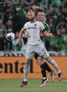 St Louis City FC forward Joao Klauss (9) blocks Austin FC defender Kipp Keller, right, from the ball during the second half of an MLS soccer match in Austin, Texas, Saturday, Feb. 25, 2023. (AP Photo/Eric Gay)