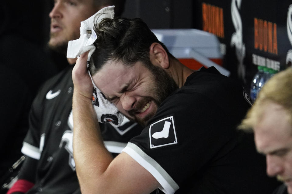 Chicago White Sox starting pitcher Lucas Giolito wipes his head in the dugout during the first inning of a baseball game against the Los Angeles Angels in Chicago, Friday, April 29, 2022. (AP Photo/Nam Y. Huh)