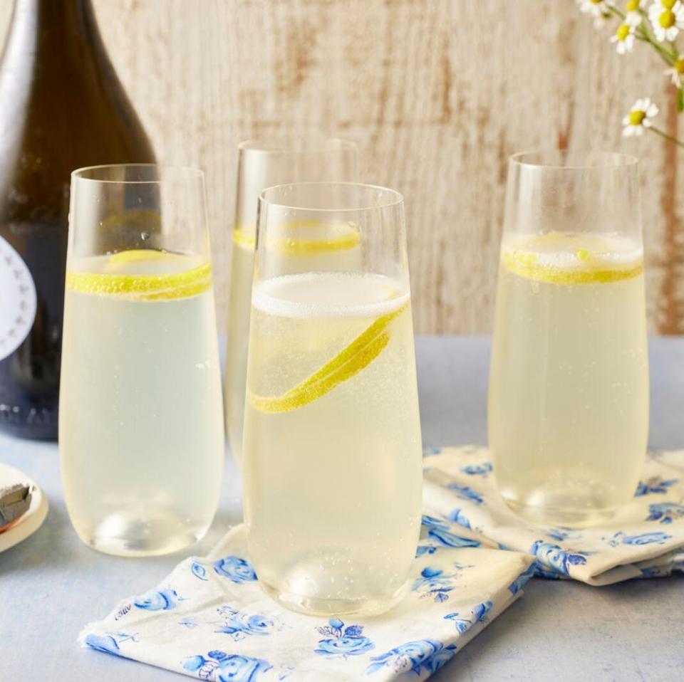 french 75 cocktail on napkin with blue flowers