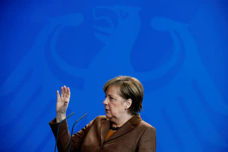 Chancellor Angela Merkel addresses a news conference at the Chancellery in Berlin, Germany, February 28, 2018. REUTERS/Hannibal Hanschke