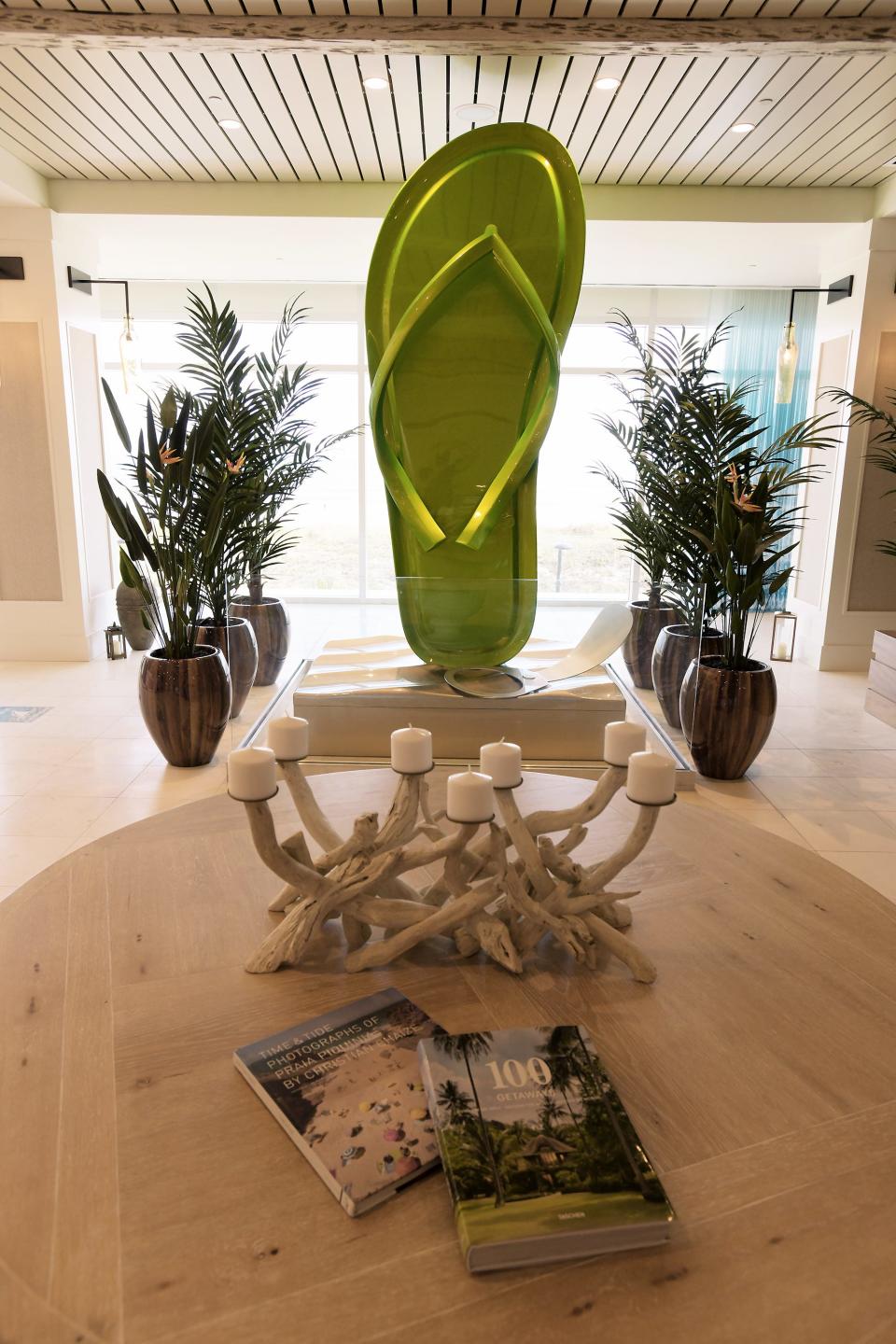 A giant flip-flop with oversized pop-top decorates the lobby of the Margaritaville Beach Hotel. The newest Margaritaville Beach Hotel in Jacksonville Beach opened its doors to customers Tuesday, January 26, 2021. The $50 million resort hotel keeps the Jimmy Buffet island theme throughout the 200 room complex with tropical decor, Caribbean colors, a two-story LandShark Bar and Grill as well as an outdoor pool for guests that runs down a section of the Beachwalk.  [Bob Self/Florida Times-Union]