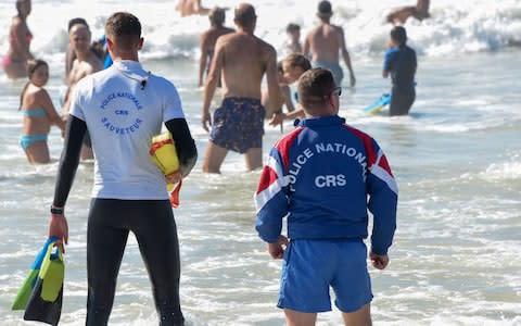 The French interior minister said “keeping watch over beaches and helping people in difficulty while swimming is not a core CRS mission" - Credit:  MEHDI FEDOUACH/AFP