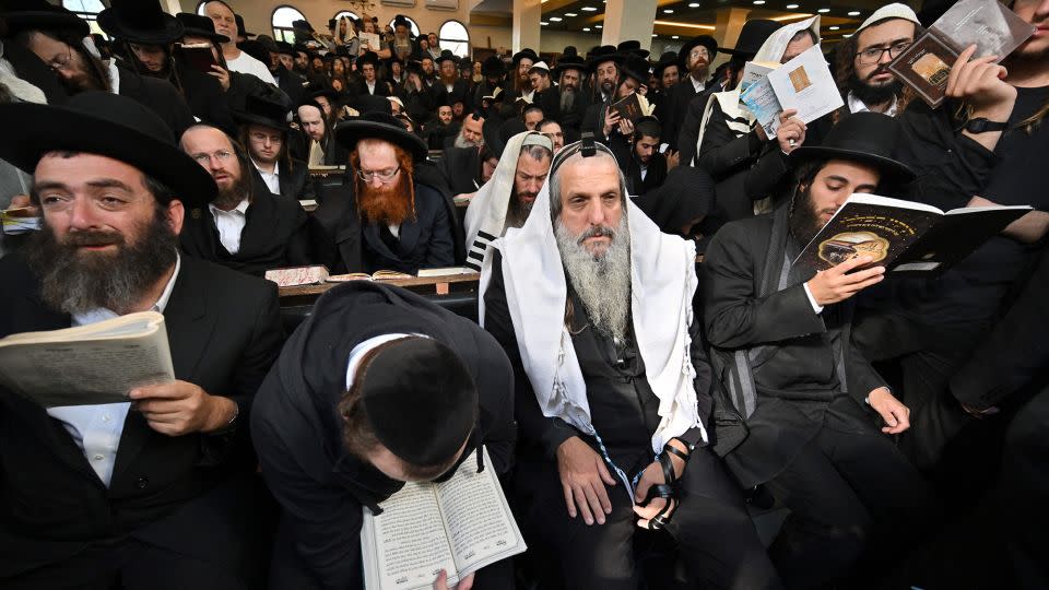 Hasidic Jewish pilgrims pray at the tomb of Rabbi Nachman for Rosh Hashana, the Jewish new year, in the town of Uman, Ukraine, on September 25, 2022. - Sergei Supinsky/AFP/Getty Images