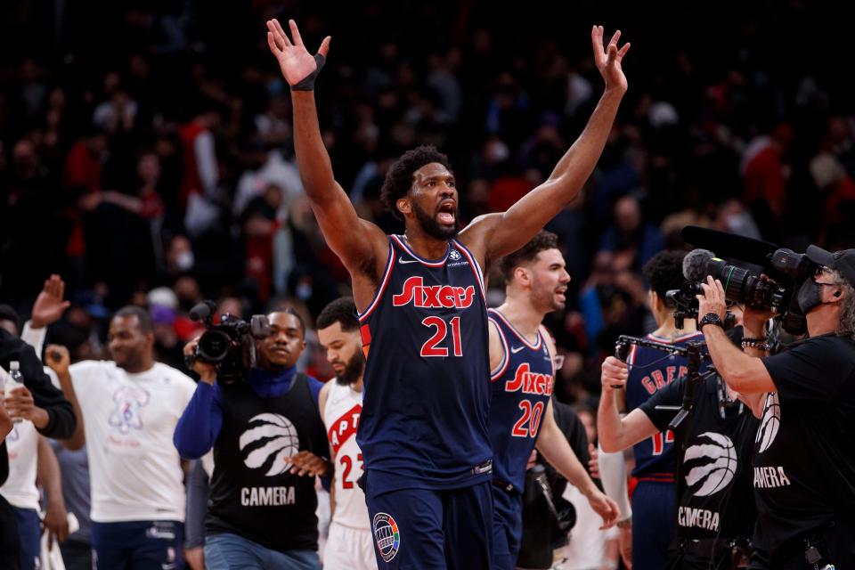 Philadelphia 76ers' Joel Embiid waves after defeating the Toronto Raptors in Game Three of the Eastern Conference First Round at Scotiabank Arena on April 20, 2022 in Toronto, Canada.