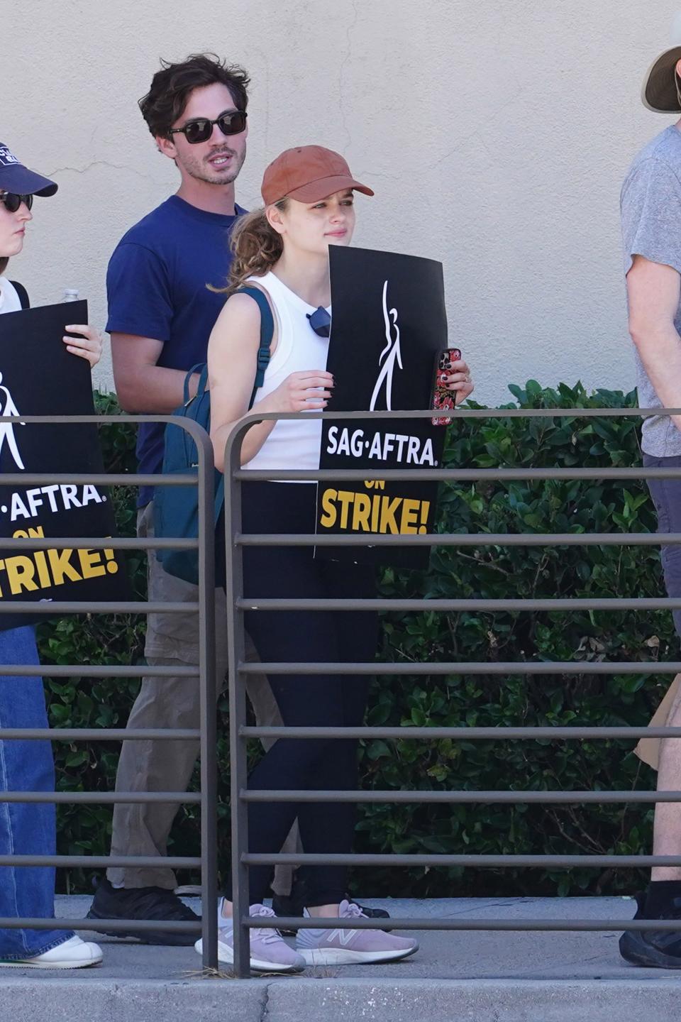 Logan Lerman and Joey King walking the picket line with striking WGA and SAG-AFTRA members on July 14, 2023 in Burbank, California.