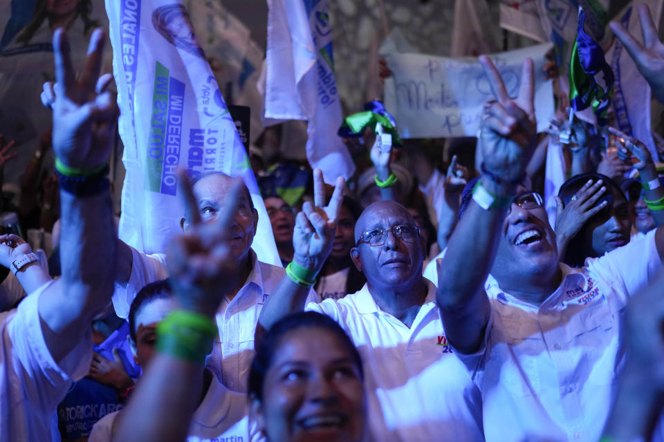 Supporters of Martin Torrijos, a former president and the presidential candidate for the Popular Party, attend a campaign rally in Panama City, Saturday, April 27, 2024. Panama will hold general elections on May 5. (AP Photo/Matias Delacroix)