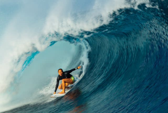 <p>Todd Glaser</p> Photo of Carissa Moore getting barreled, featured in her new book "Carissa Moore: Hawaii Gold: A Celebration of Surfing"
