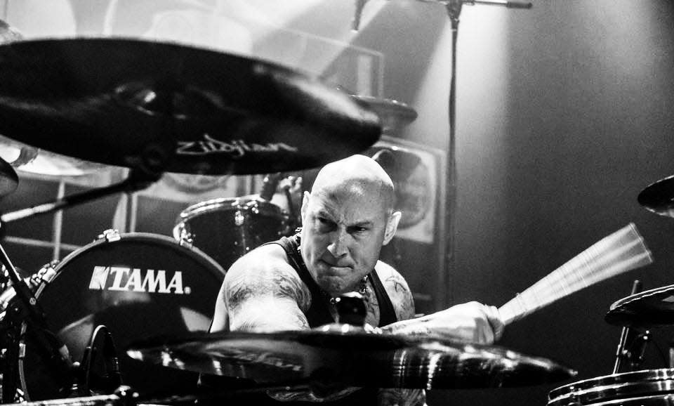 Hornell native Mick Palmesano is shown behind the drum kit during his time in the rock music industry in the 1990s and early 2000s. A charity, Palmesano Strong, has been started in Palmesano's name with plans to help those suffering from ALS.