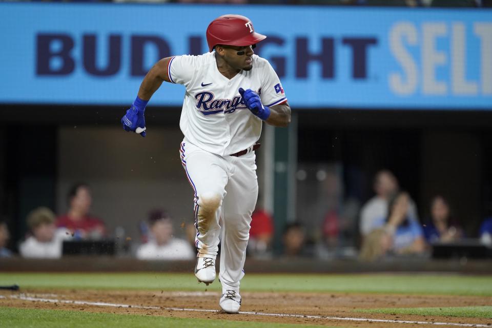 Texas Rangers' Andy Ibanez sprints towards first on his two-run single in the second inning of a baseball game against the Los Angeles Angels in Arlington, Texas, Tuesday, Sept. 28, 2021. (AP Photo/Tony Gutierrez)