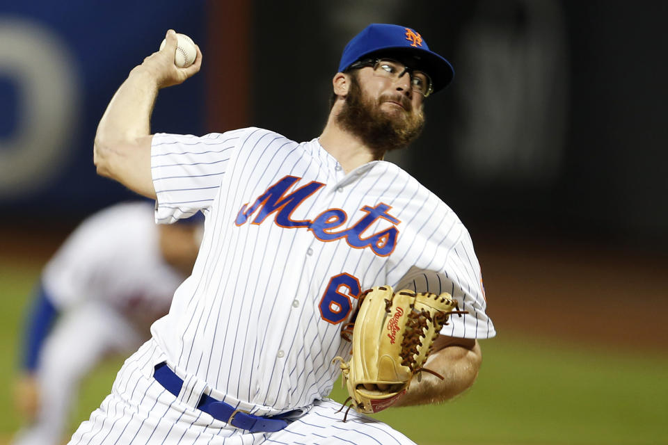 FILE - In this Aug. 4, 2018, file photo, New York Mets pitcher Bobby Wahl delivers during the eighth inning of a baseball game against the Atlanta Braves in New York. The Mets traded Wahl to the Milwaukee Brewers on Saturday, Jan. 5, 2019, along with a pair of minor leaguers, right-handed reliever Adam Hill and infielder Felix Valerio. The Mets Mets received outfielder Keon Broxton. (AP Photo/Adam Hunger, File)