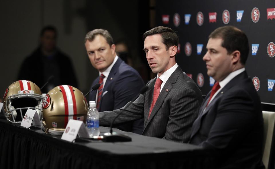 San Francisco 49ers head coach Kyle Shanahan, center, answers questions next to general manager John Lynch, left, and owner Jed York during an NFL football press conference Thursday, Feb. 9, 2017, in Santa Clara, Calif. (AP Photo/Marcio Jose Sanchez)