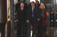 In this Sunday, Jan. 6, 2019, photo, members of a U.S. trade delegation including deputy U.S. trade representative, Jeffrey D. Gerrish, left, leave a hotel in Beijing. The U.S. delegation led by Gerrish arrived in the Chinese capital ahead of trade talks with China. China sounded a positive note ahead of trade talks this week with Washington, but the two sides face potentially lengthy wrangling over technology and the future of their economic relationship. (AP Photo/Ng Han Guan)