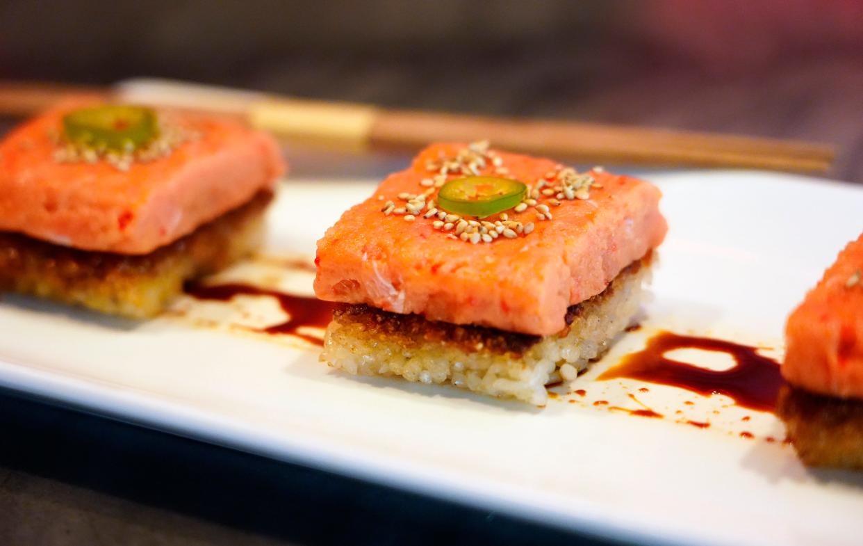 Crispy rice with spicy tuna tartare, smoked soy, seared rice and serrano at Baru.