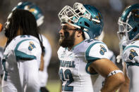 Coastal Carolina linebacker Coleman Reich (22) watches the replay board during a timeout in the first half of the team's NCAA college football game against Appalachian State on Wednesday, Oct. 20, 2021, in Boone, N.C. (AP Photo/Matt Kelley)