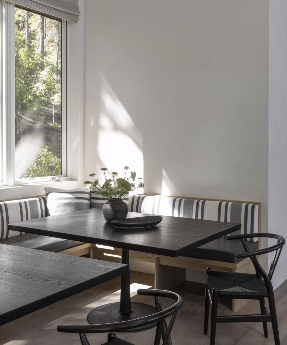 dining nook with window and built in banquette