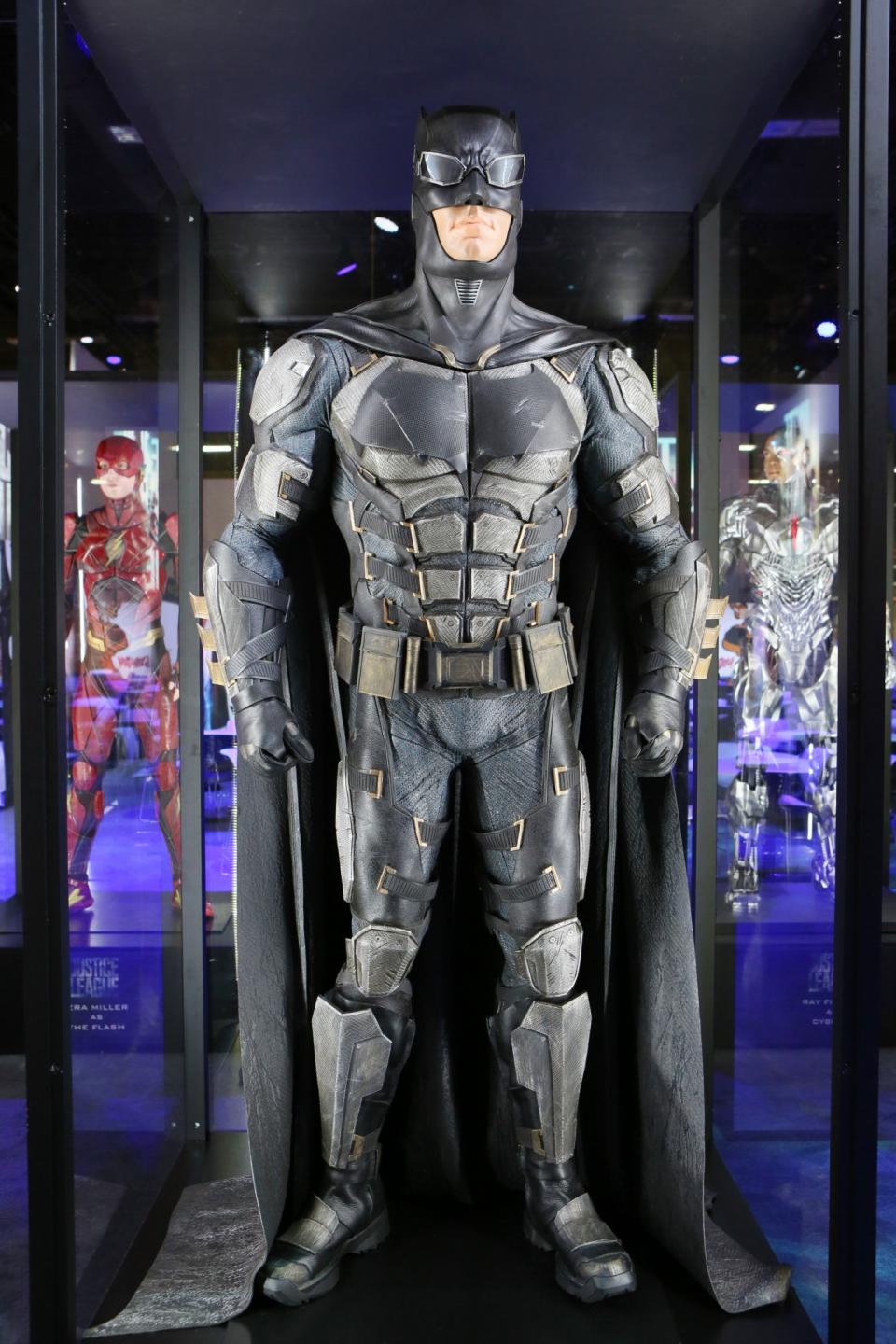 <p>Ben Affleck’s back as the Dark Knight in a retooled costume reminicent of the <i>Arkham</i> video games. Dig those Bat-goggles! (Credit: Warner Bros.) </p>