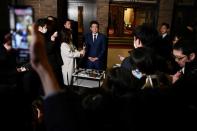 Japan's Prime Minister Shinzo Abe talks to the journalists in front of the prime minister's residence in Tokyo