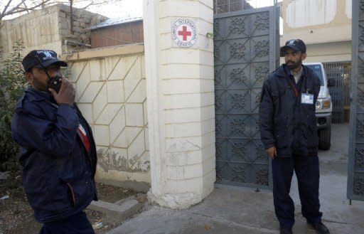 Pakistani private security guards stand outside the office of the International Committee of the Red Cross where a British employee Khalil Dale was kidnapped in Quetta on January 5. Dale was found beheaded and dumped in a bag, with a note saying he was killed after his captors' demands were not met, police said