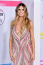 <p>Supermodel Heidi Klum showed off her ample assets in a sequinned pink and cream gown with a plunging neckline.</p>