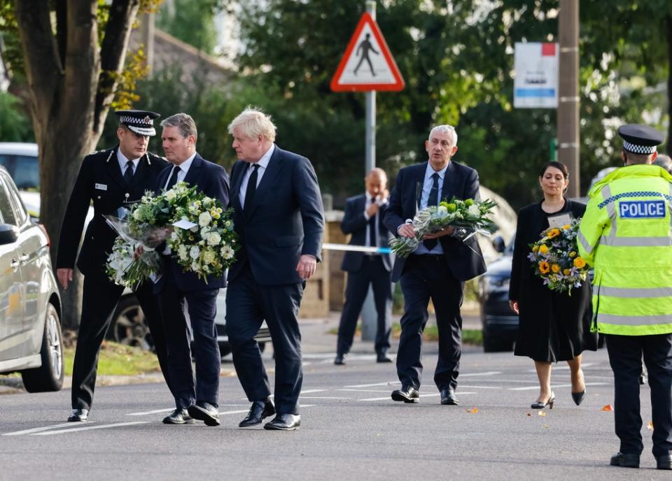 Sir Lindsay Hoyle, right, joined the Prime Minister on Saturday to lay flowers at the scene of Sir David Amess’s killing (Dominic Lipinski/PA) (PA Wire)