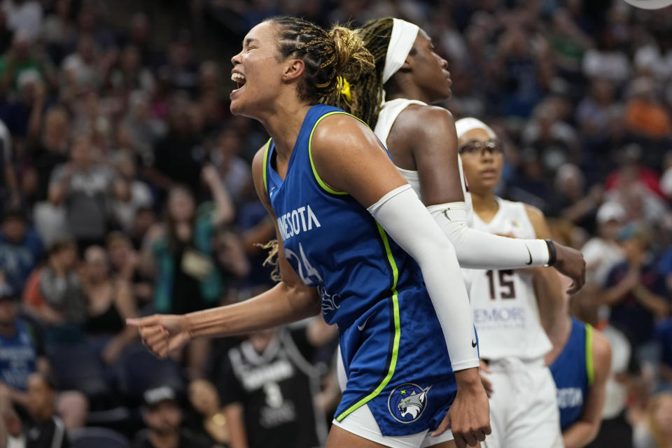 CORRECTS TO OVERTIME NOT SECOND HALF - Minnesota Lynx forward Napheesa Collier celebrates after making a basket while fouled during overtime of a WNBA basketball game against the Atlanta Dream, Friday, Sept. 1, 2023, in Minneapolis. (AP Photo/Abbie Parr)