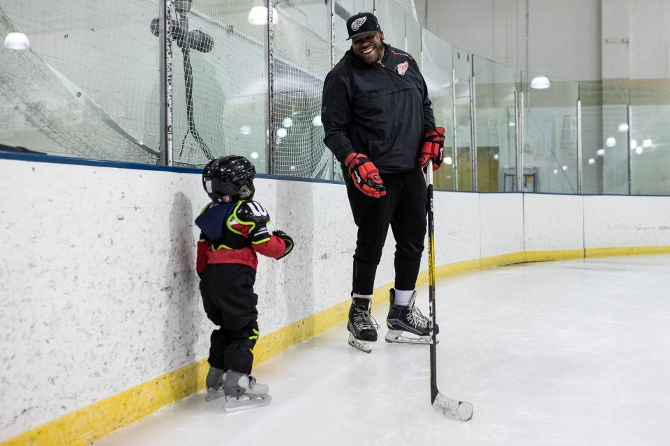 Jason McCrimmon of Detroit Ice Dreams talks to Kylan James, 2, during hockey practice at the Jack Adams Memorial Arena in Detroit on Wednesday, May 4, 2022.