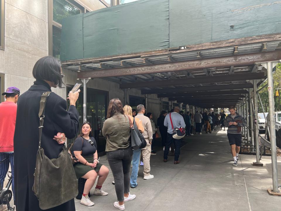 People wait in line at the Gramercy Park Hotel liquidation sale in New York City