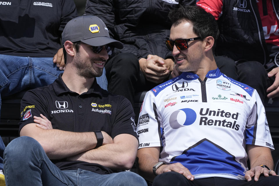 Alexander Rossi, left, talks with Graham Rahal during the drivers meeting for the Indianapolis 500 auto race at Indianapolis Motor Speedway, Saturday, May 28, 2022, in Indianapolis. (AP Photo/Darron Cummings)