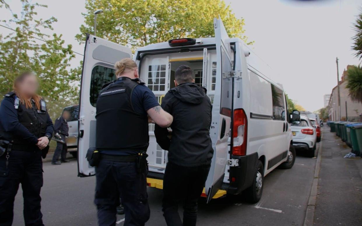 Immigration officers carrying out a detention visit