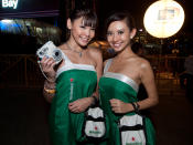 Heineken beer promoters, with their trusty polaroid camera. (Yahoo! photo/Alvin Ho)