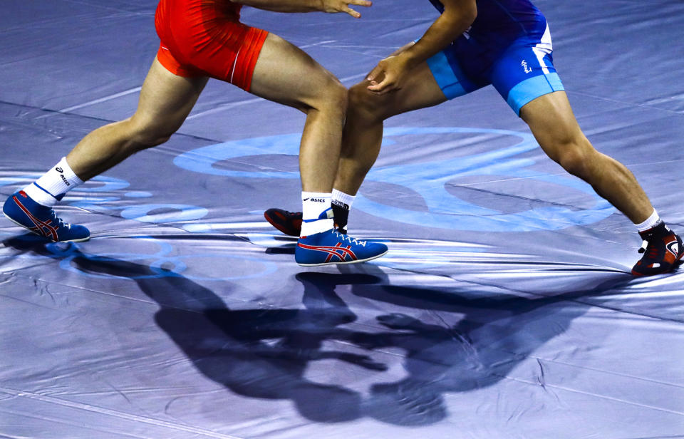 <p>China’s Yang Bin, red, competes against Morocco ‘s Zied Ait Ouagram during the during the men’s Greco-Roman competition at the 2016 Summer Olympics in Rio de Janeiro, Brazil, Sunday, Aug. 14, 2016. (AP Photo/Markus Schreiber) </p>